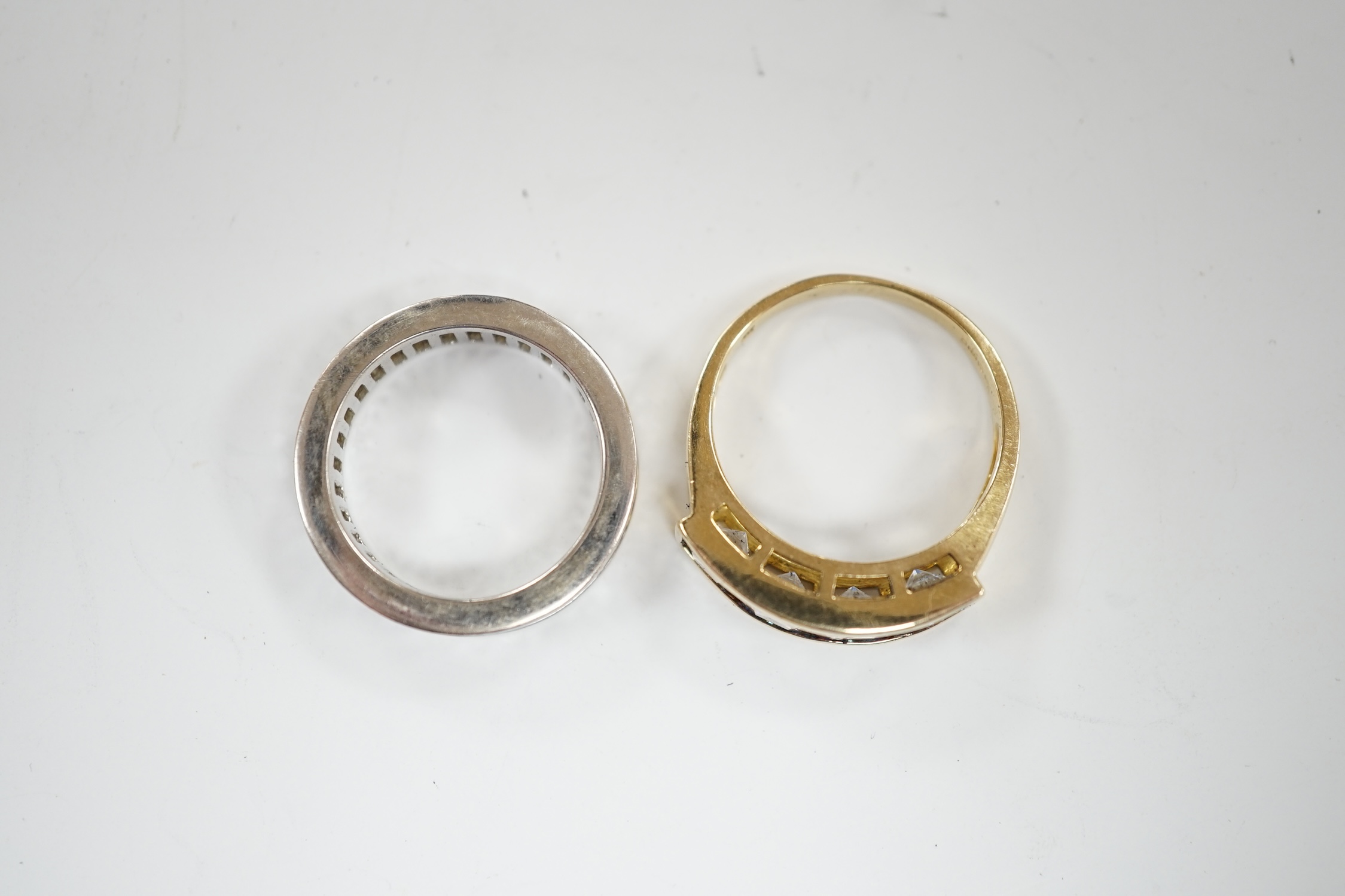 A 9k and simulated diamond set half hoop ring and a 925 and simulated diamond set eternity ring.
